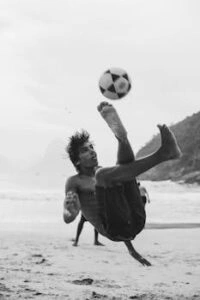 Soccer player performing a bicycle kick showing off skills
